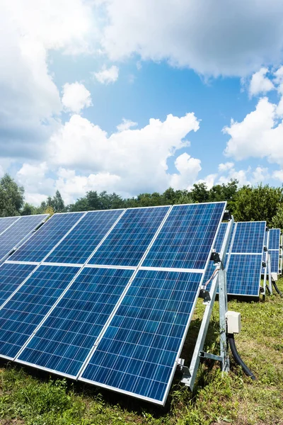 Blue solar energy batteries with copy space and cloudy sky — Stock Photo