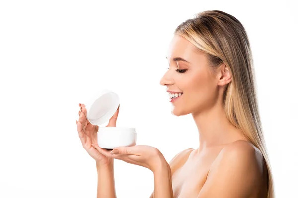 Весела гола жінка тримає косметичний крем ізольовано на білому — стокове фото