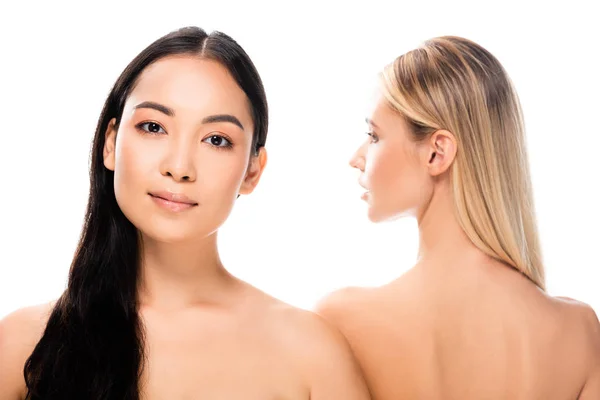 Asian brunette naked girl standing back to back with blonde woman isolated on white — Stock Photo