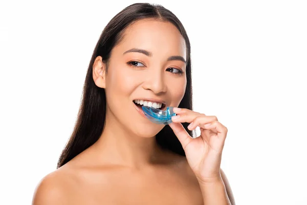 Smiling naked asian woman with mouth guard isolated on white — Stock Photo