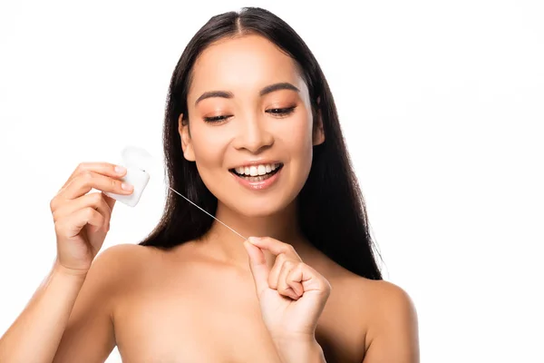 Feliz asiático desnudo mujer con dental hilo dental aislado en blanco - foto de stock