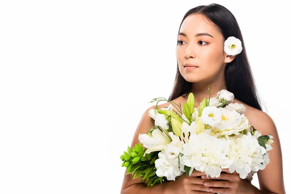 Beautiful asian naked woman holding flowers isolated on white — Stock Photo