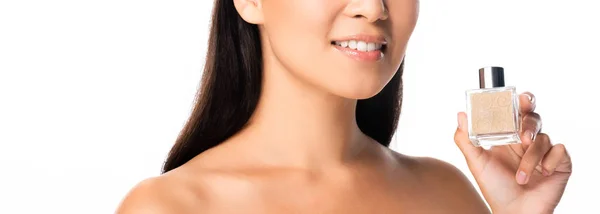 Recortado vista de desnudo hermosa mujer asiática celebración perfume aislado en blanco — Stock Photo