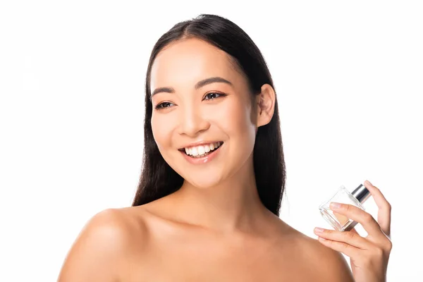 Happy naked beautiful asian woman holding perfume isolated on white — Stock Photo