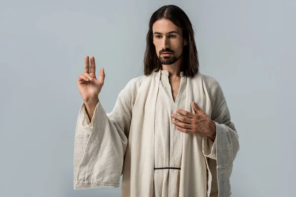 Religious man in jesus robe gesturing isolated on grey — Stock Photo