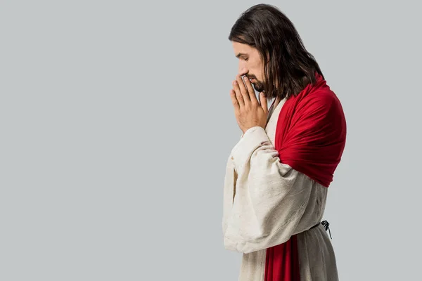Side view of man with closed eyes praying isolated on grey — Stock Photo