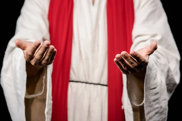 Selective focus of man gesturing isolated on black — Stock Photo