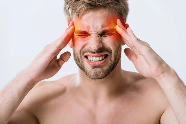 Front view of shirtless man with headache touching temples isolated on grey — Stock Photo