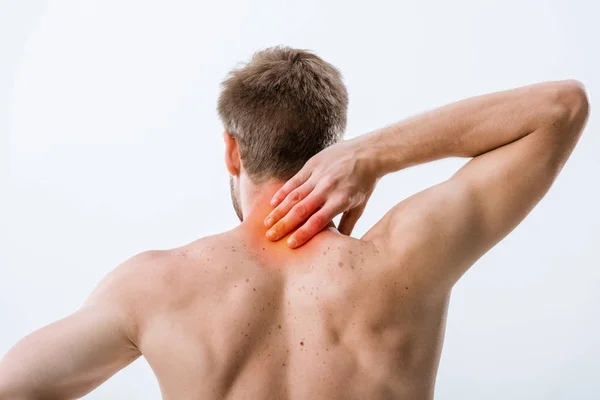 Back view of shirtless man with neck pain isolated on grey — Stock Photo