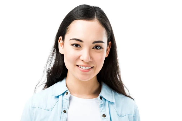 Attractive and smiling asian woman in denim shirt looking at camera isolated on white — Stock Photo