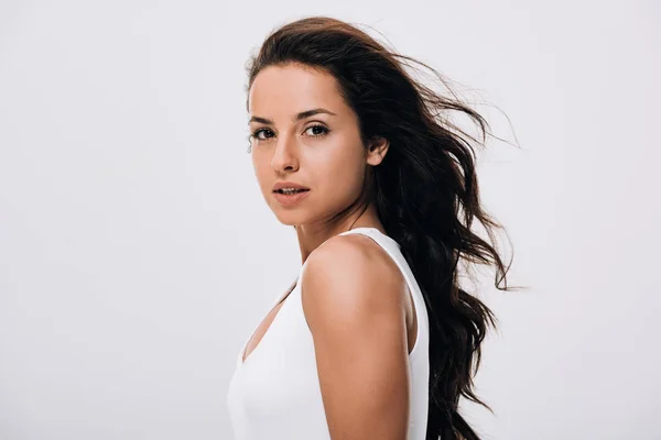 Brunette beautiful woman with long healthy and shiny hair isolated on grey — Stock Photo