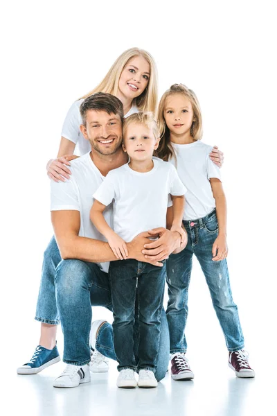 Positive family smiling while looking at camera on white — Stock Photo