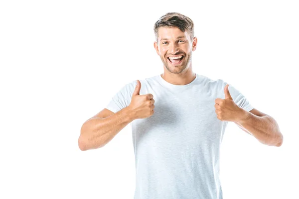 Cheerful and handsome man showing thumbs up isolated on white — Stock Photo