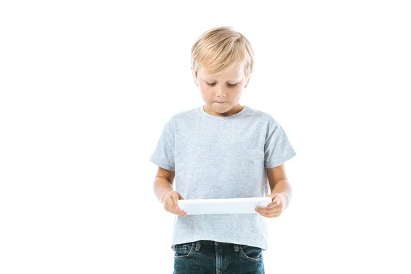 Menino bonito usando tablet digital isolado no branco — Fotografia de Stock