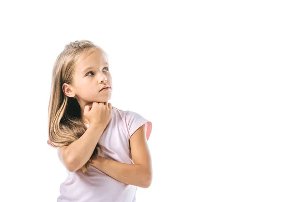 Cute and pensive kid touching face and looking away isolated on white — Stock Photo