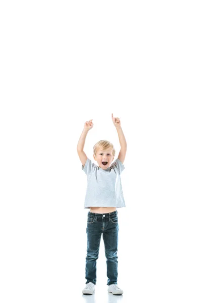 Excited boy with opened mouth pointing with fingers isolated on white — Stock Photo