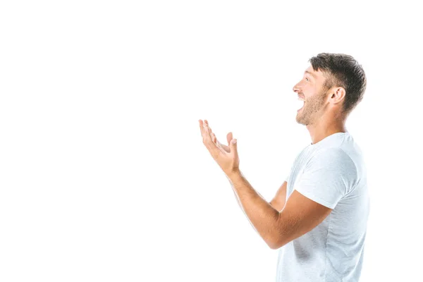 Side view of excited man pointing with hands isolated on white — Stock Photo