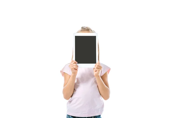 Kid covering face while holding digital tablet with blank screen isolated on white — Stock Photo