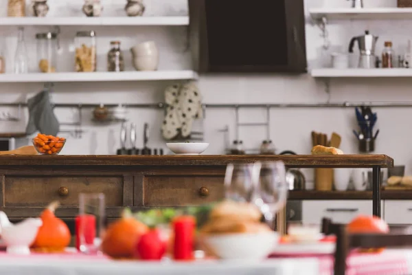 Selective focus of table with carrot and bowl in Thanksgiving day — Stock Photo