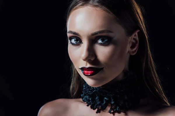 Scary vampire girl in black gothic dress isolated on black — Stock Photo