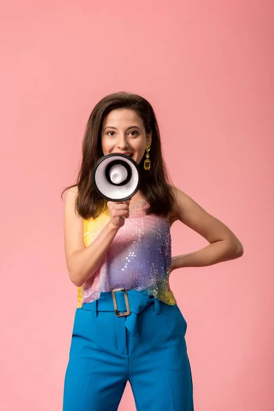 Young stylish disco girl with megaphone isolated on pink — Stock Photo