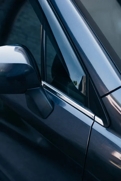 Part of front right front side of black modern car — Stock Photo