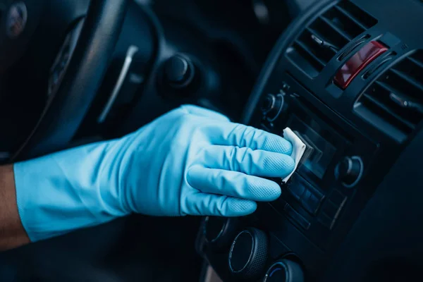 Cropped view of car cleaner polishing control panel on dashboard — Stock Photo