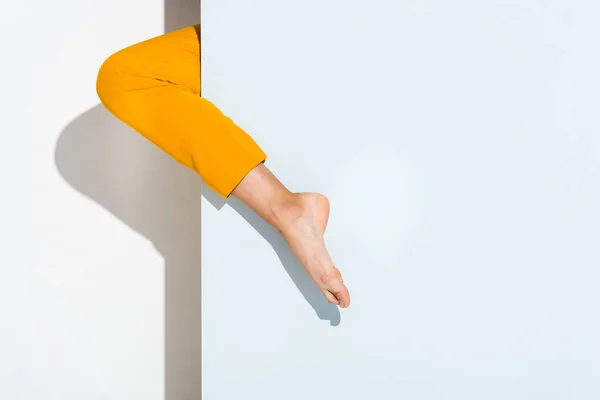 Cropped view of woman with barefoot standing on white — Stock Photo