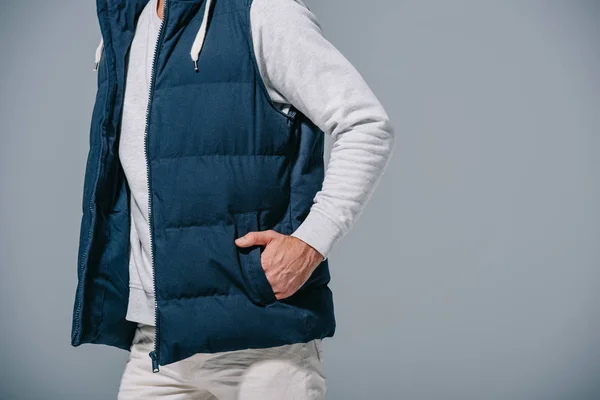 Cropped view of man posing in autumn waistcoat, isolated on grey — Stock Photo