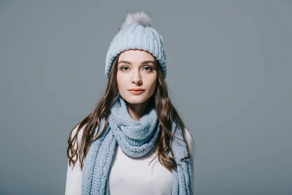 Beautiful elegant woman posing in knitted hat and scarf, isolated on grey — Stock Photo