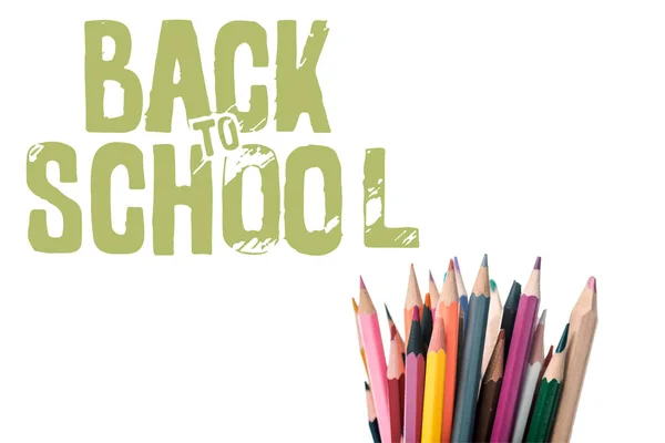 Multicolored pencils near back to school letters on white — Stock Photo