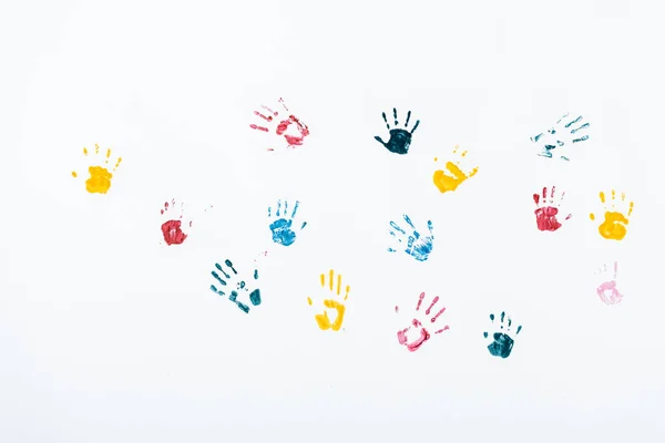 Multicolored and bright hand prints on white — Stock Photo