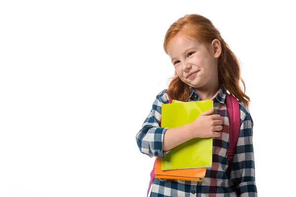 Niedliche rothaarige Kind hält Bücher isoliert auf weiß — Stockfoto