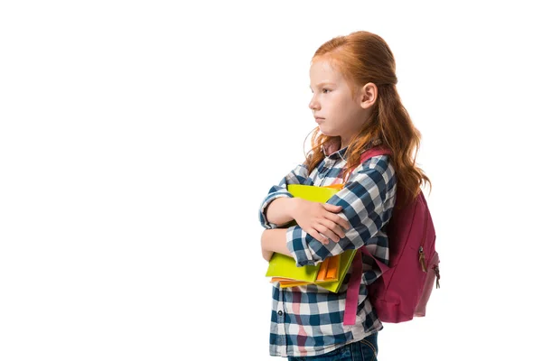 Bouleversé rousse enfant tenant des livres isolés sur blanc — Photo de stock
