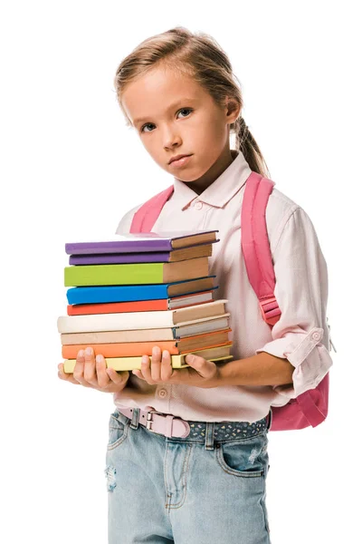 Adorable pupil holding colorful books isolated on white — Stock Photo