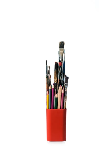 Pen holder with colorful pencils and paintbrushes isolated on white — Stock Photo