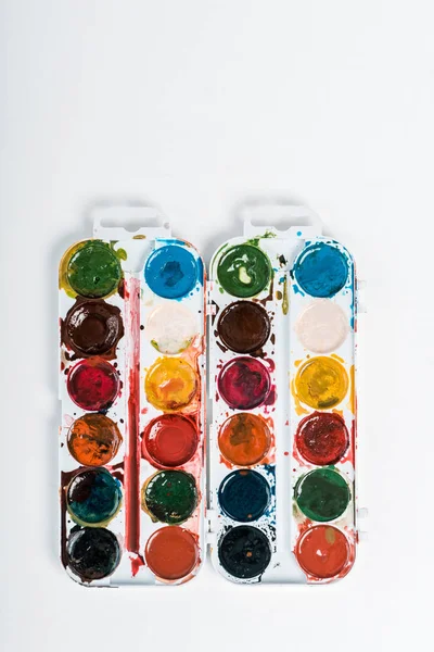 Top view of colorful watercolor paint isolated on white — Stock Photo