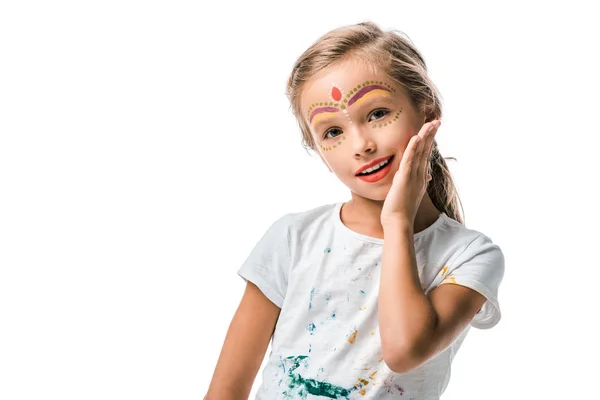Positive child with face painting smiling isolated on white — Stock Photo