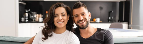 Website header of happy young couple looking at camera — Stock Photo