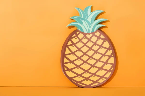 Paper artwork pineapple on orange with copy space, summer concept — Stock Photo