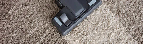 Panoramic orientation of brush of vacuum cleaner on dirty carpet — Stock Photo