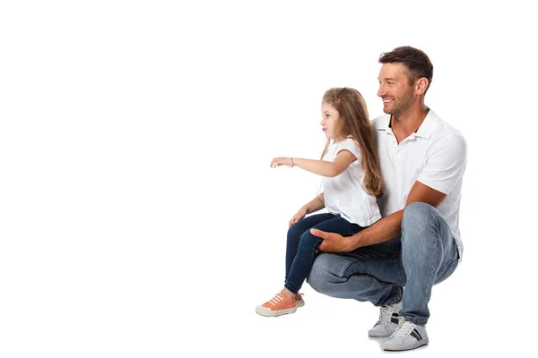 Carino figlia seduta su felice padre isolato su bianco — Foto stock