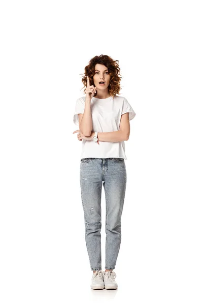 Curly woman standing and gesturing while having idea on white — Stock Photo