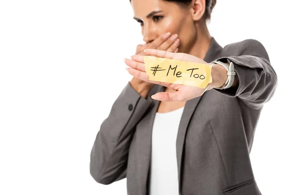 Selective focus of businesswoman with me too lettering on hand covering mouth isolated on white, gender inequality concept — Stock Photo