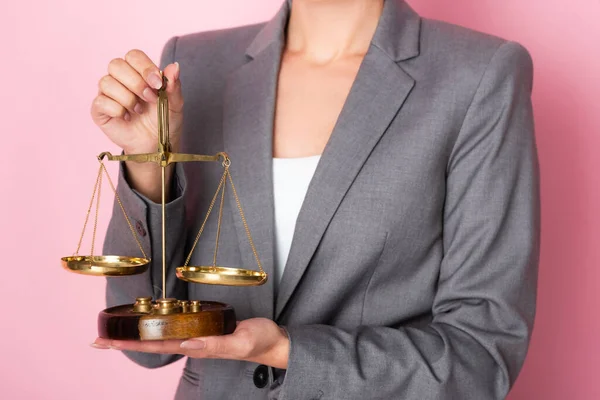 Cropped view of businesswoman holding scales on pink, gender equality concept — Stock Photo