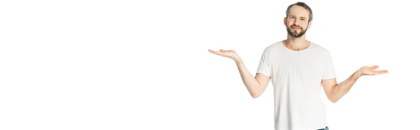 Smiling man showing shrug gesture isolated on white, panoramic shot — Stock Photo