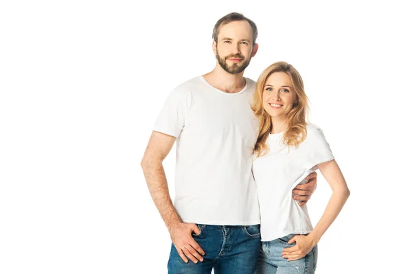 Cheerful adult couple in white t-shirts embracing isolated on white — Stock Photo