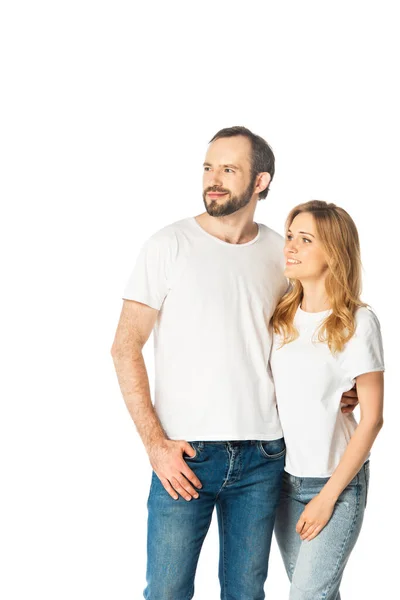 Cheerful adult couple in white t-shirts embracing isolated on white — Stock Photo