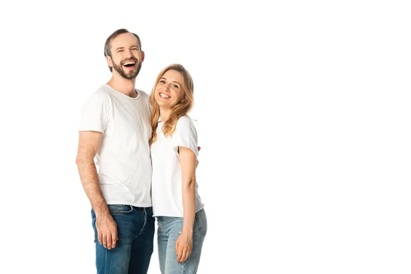 Happy adult couple in white t-shirts embracing isolated on white — Stock Photo