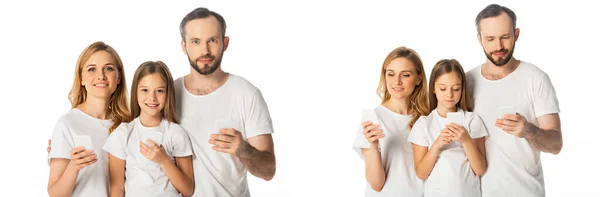 Collage of smiling family in white t-shirts using smartphones isolated on white, panoramic shot — Stock Photo